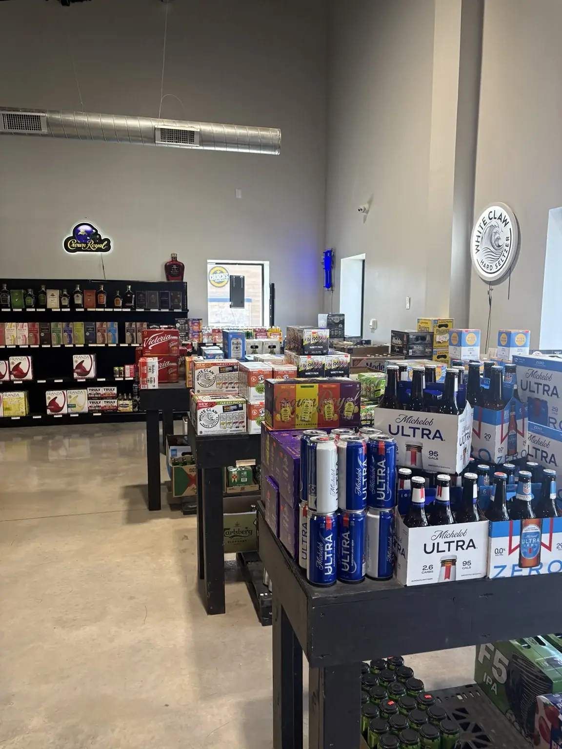 Beer packs and canned drinks on a display inside One Stop Liquor in Bethany, Oklahoma